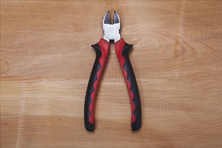 Side chisel, repair materials on wooden table background.