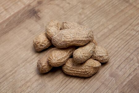 Peanut on wooden table.Healthy food and snack.