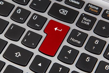 Red and black keys on top of the keyboard.の写真素材