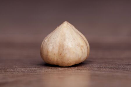 Hazelnut on wooden table. Healthy food and snack.