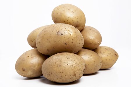 Potatoes on the white background.の写真素材