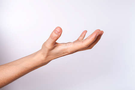 Woman hand showing on white background.の写真素材