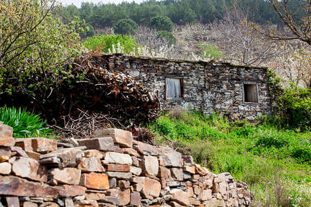 A very old and ruined house in the countryside.