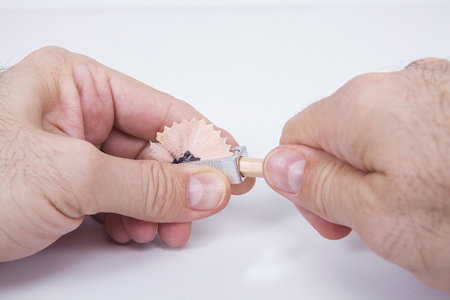 Pencil sharpener with pencils on a white background.の写真素材