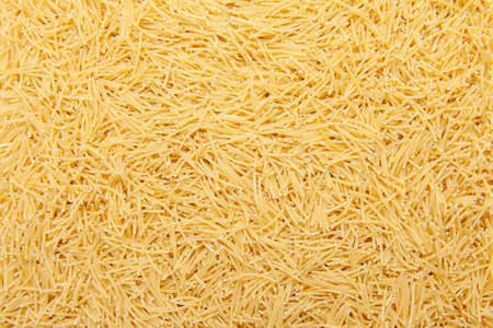 Heaps of uncooked, organic noodles.の写真素材