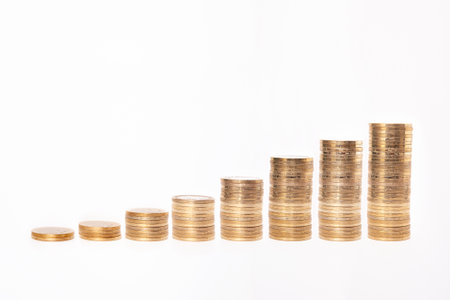 Close-up of stack of coins on white background.