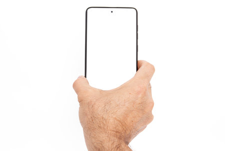 Hand holding mobile phone and blank screen for template advertising and branding technology background. Can be use for any user interface test or presentation.の写真素材