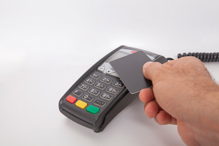 Contactless payment by credit card. POS terminal NFC payment. Concept of how to choose payment method for shopping in a store.の写真素材