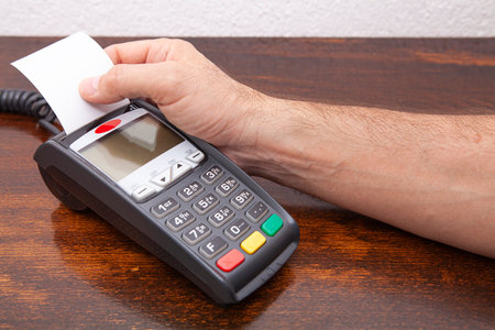 Contactless payment by credit card. POS terminal NFC payment. Concept of how to choose payment method for shopping in a store.の写真素材