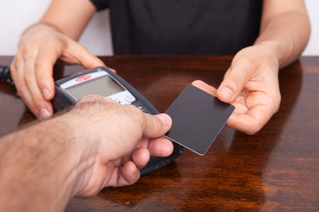 Contactless payment by credit card. POS terminal NFC payment. Concept of how to choose payment method for shopping in a store.の写真素材
