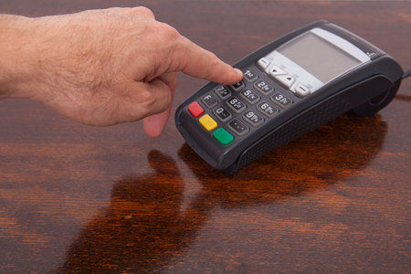 Contactless payment by credit card. POS terminal NFC payment. Concept of how to choose payment method for shopping in a store.の写真素材
