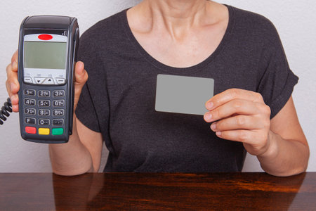 Contactless payment by credit card. POS terminal NFC payment. Concept of how to choose payment method for shopping in a store.の写真素材
