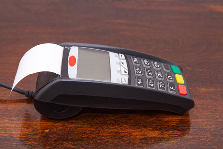 Contactless payment by credit card. POS terminal NFC payment. Concept of how to choose payment method for shopping in a store.の写真素材