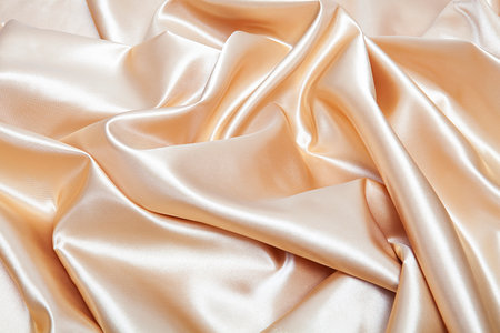 Elegant yellow silk satin fabric background.の写真素材