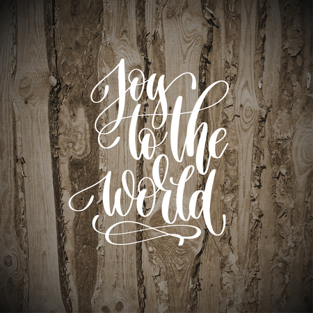 A joy to the world - hand lettering inscription quote to christmas design on wood textures, calligraphy vector illustrationのイラスト素材