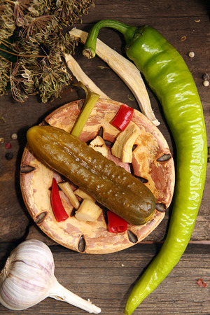 Canned pickled marinated cucumber with spices and herbsの写真素材