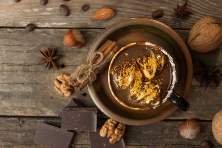 Cup of hot chocolate. Mug of traditional winter chocolate drink. Rustic vintage style. Top view.の写真素材