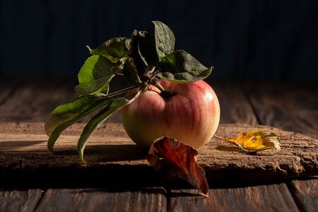 Organic natural apple on wooden background.