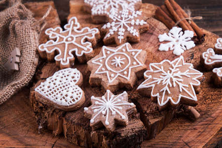 gingerbread cookies, Christmas and New Year ornament on old wooden background. Overhead of Christmas New Year holiday background. Top view. Copy spaceの写真素材