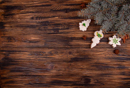 Greeting card with decor homemade gingerbread cookies, Christmas and New Year ornament on old wooden...