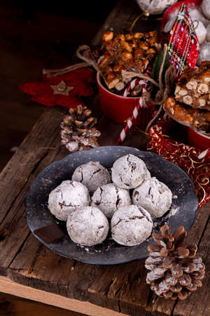Traditional Christmas almond chocolate snowballs cookies biscuits covered icing sugar powder. Russian Tea Cakes, Mexican Wedding Cookies, Butterballs. top view. copy spaceの写真素材