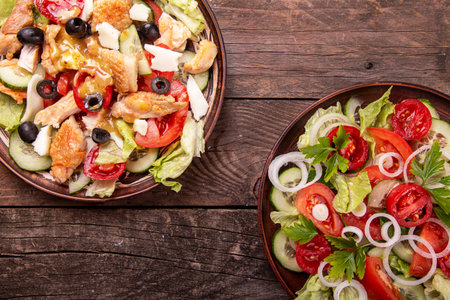 Two salad.. Vegetable and meat salad of mozzarella, cheese, olives, chicken, cucumber, tomatoes and...
