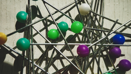 Multicolor pin on white. pushpin set in different colors of the button, randomlyの写真素材
