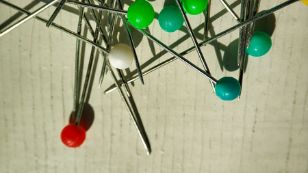 Multicolor pin on white. pushpin set in different colors of the button, randomlyの写真素材