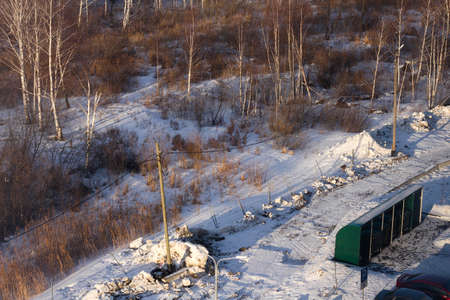 Garbage containers next to nature forest. Caring for environment. View from aboveの写真素材