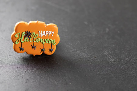 Bright happy Halloween gingerbread cookies on a black backgroundの写真素材