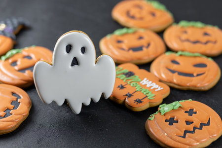 Bright Halloween gingerbread cookies on a black backgroundの写真素材