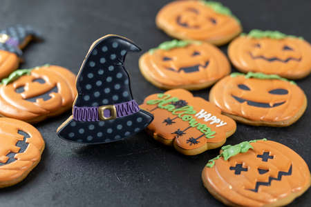Bright Halloween gingerbread cookies on a black backgroundの写真素材