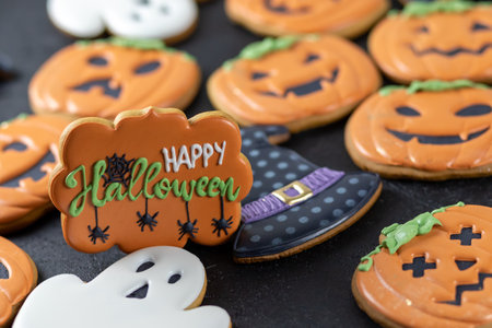 Bright Halloween gingerbread cookies on a black backgroundの写真素材