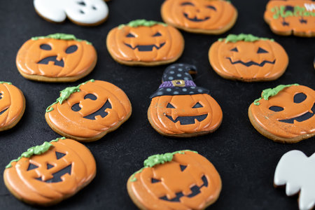 Bright Halloween gingerbread cookies on a black backgroundの写真素材
