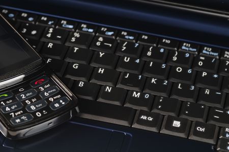 Cellphone on keyboard.