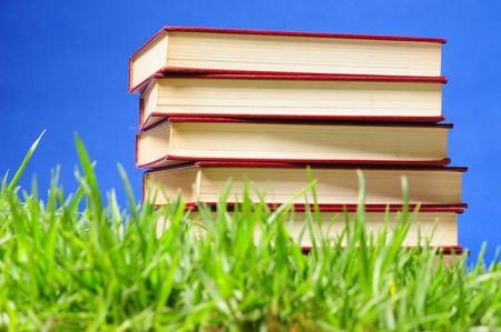 Books on grass. Educational concept.の写真素材