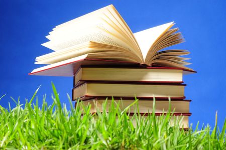 Books on grass. Educational concept.の写真素材
