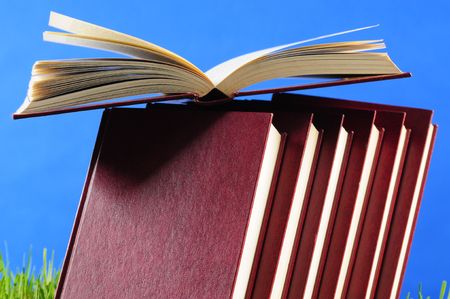 Books on grass.