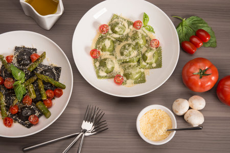 Rigatoni pasta with green asparagus and cherry tomatoesの写真素材