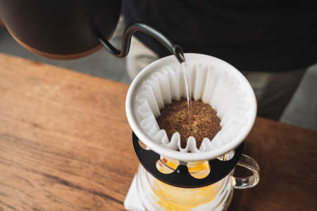 barista dripping coffee and slow coffee wooden bar styleの写真素材
