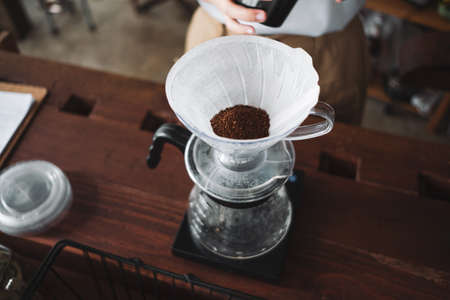 barista dripping coffee and slow coffee wooden bar styleの写真素材