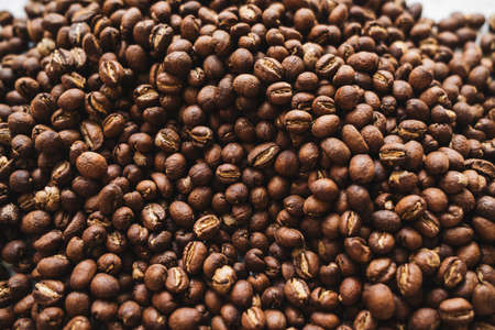 Premium Roasted coffee beans on backgroundの写真素材