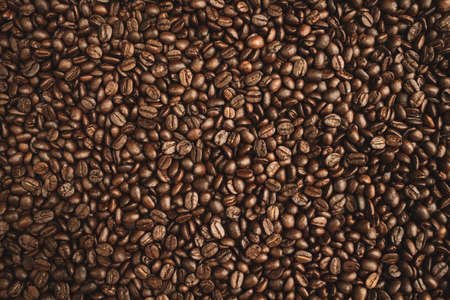 Premium Roasted coffee beans on backgroundの写真素材