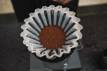 barista dripping coffee and slow coffee bar style