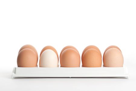 the hen's eggs in egg holder on white backgroundの写真素材