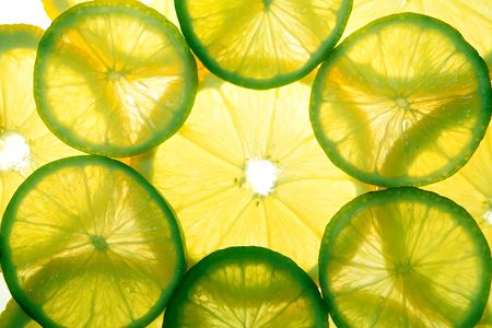 Yellow lemon and green lime slices in two layersの写真素材