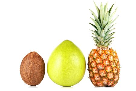 Pineapple, pomelo and coconut on white background