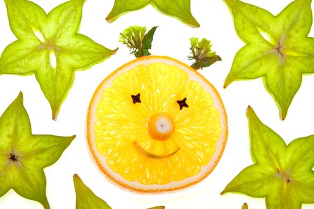 Starfruit (carambola) slices with orange face on white backgroundの写真素材