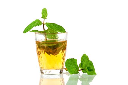 Alcohol cocktail with whiskey and mint isolated on white backgroundの写真素材