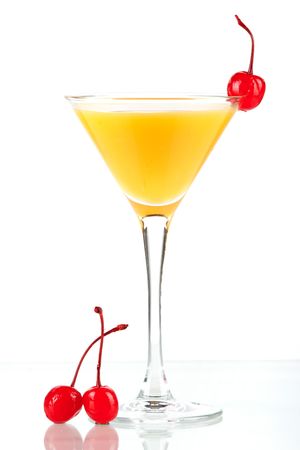 Alcohol cocktail with orange juice and maraschino isolated on white backgroundの写真素材
